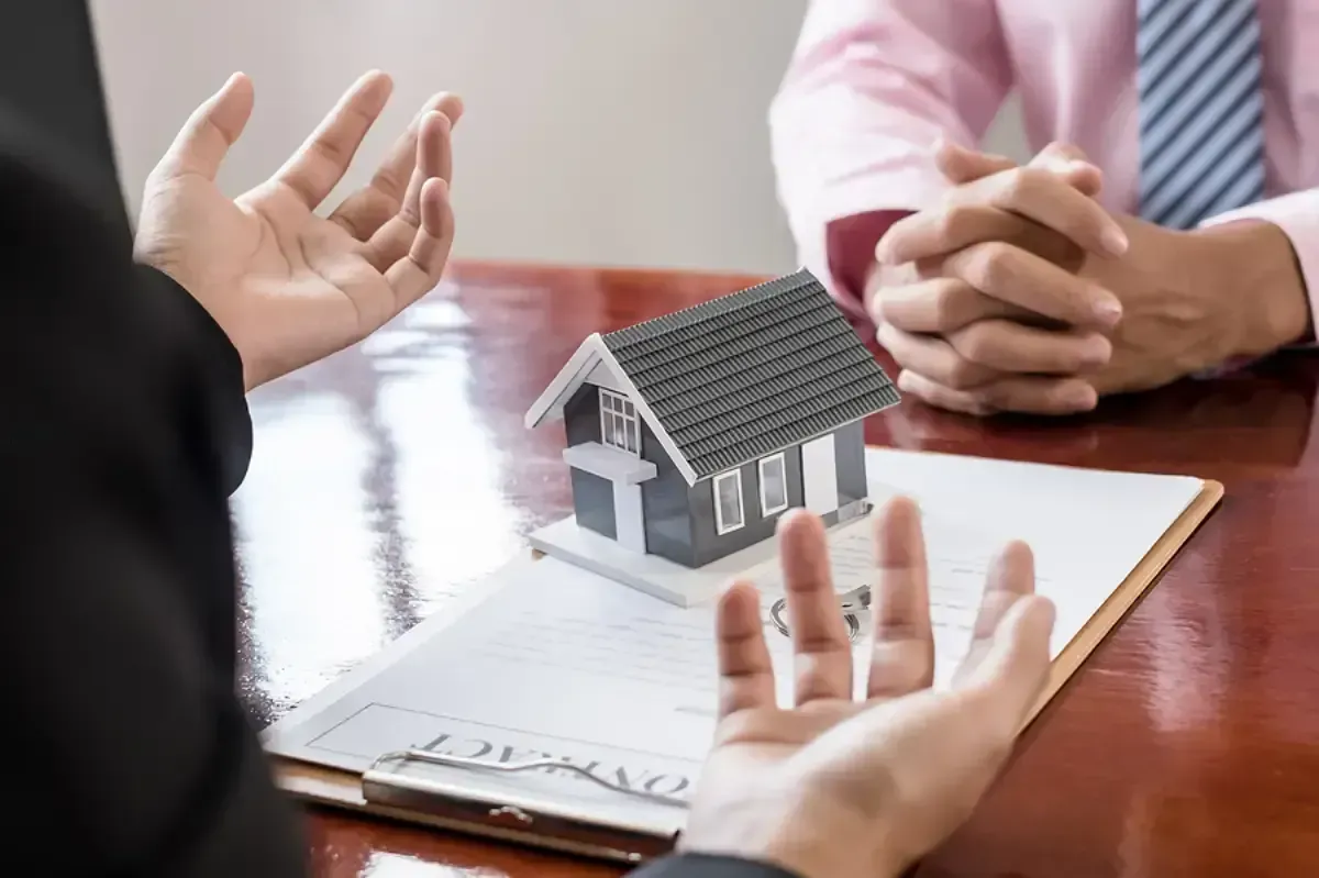 Real estate agent handing over the keys to a West Jordan, UT rental home.